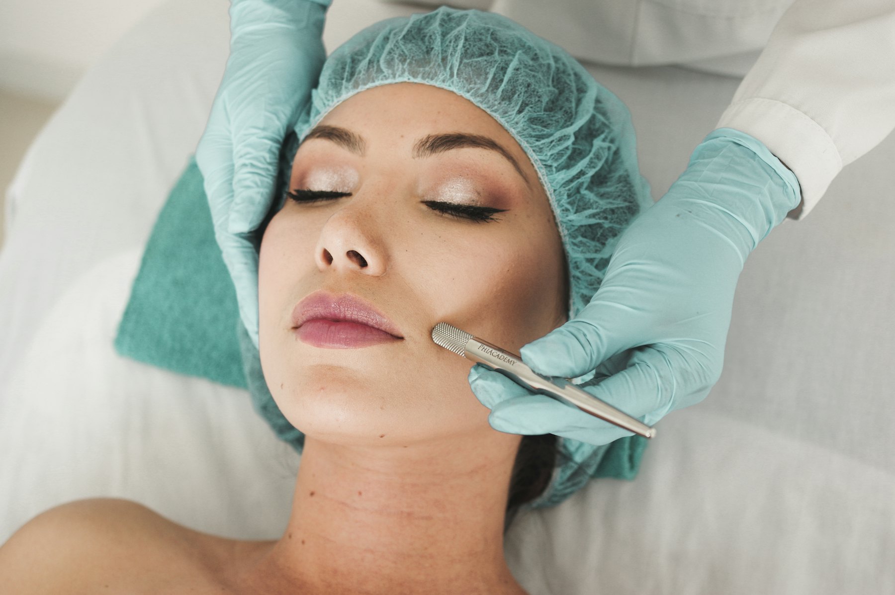 A client’s face being prepared for treatment